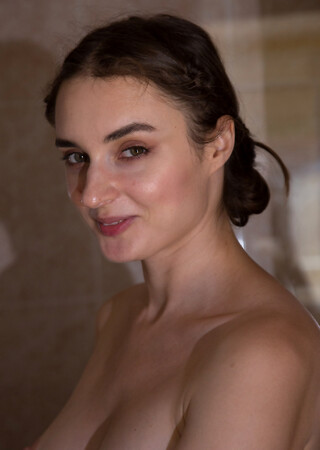 Amateur with nice tits Vitalia Pugova removes her sheer bodysuit and showers